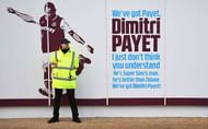 LONDON, ENGLAND - JANUARY 14:  A steward guards the Dimitri Payet of West Ham United sign outside the stadium prior to the Premier League match between West Ham United and Crystal Palace at London Stadium on January 14, 2017 in London, England.  (Photo by Shaun Botterill/Getty Images)